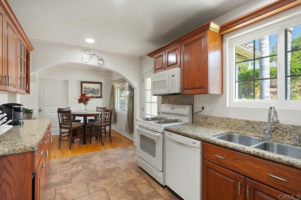 3335 Fairway Drive La Mesa, CA 91941 - Photo 14 of 30 a kitchen with appliances cabinets and dining table chair