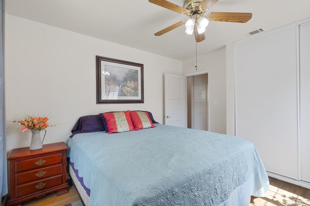 3335 Fairway Drive La Mesa, CA 91941 - Photo 17 of 30 a bedroom with a bed and a chandelier