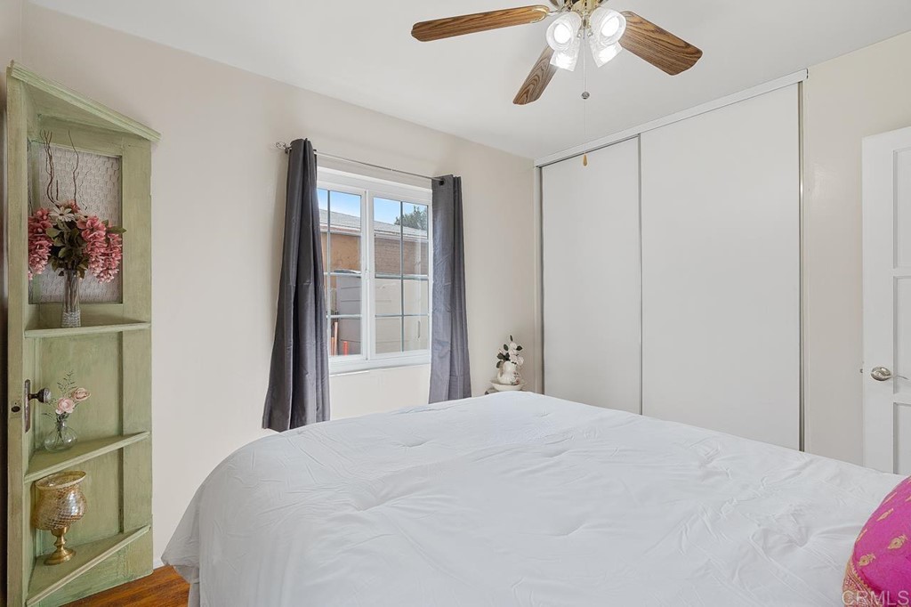 3335 Fairway Drive La Mesa, CA 91941 - Photo 18 of 30 a bedroom with a large bed and a chandelier