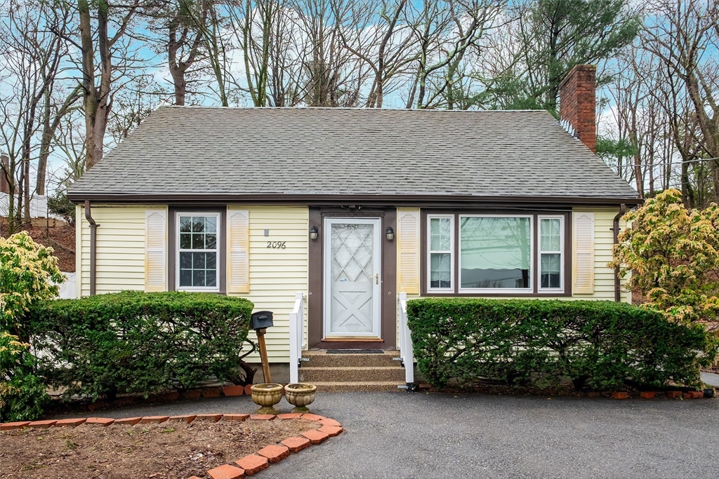 2096 Washington Street Newton, MA 02468 - Photo 1 of 13 a front view of a house with garden