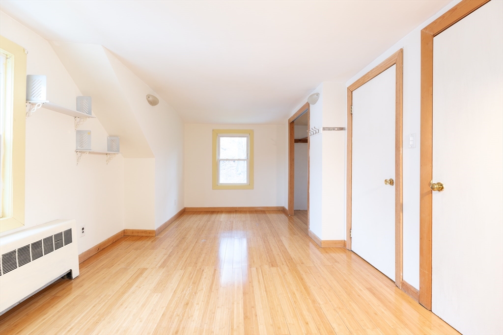 2096 Washington Street Newton, MA 02468 - Photo 12 of 13 a view of empty room with wooden floor and fan