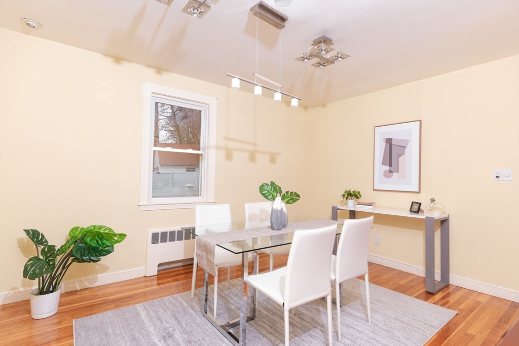 2096 Washington Street Newton, MA 02468 - Photo 5 of 13 a dining room with furniture potted plants and wooden floor