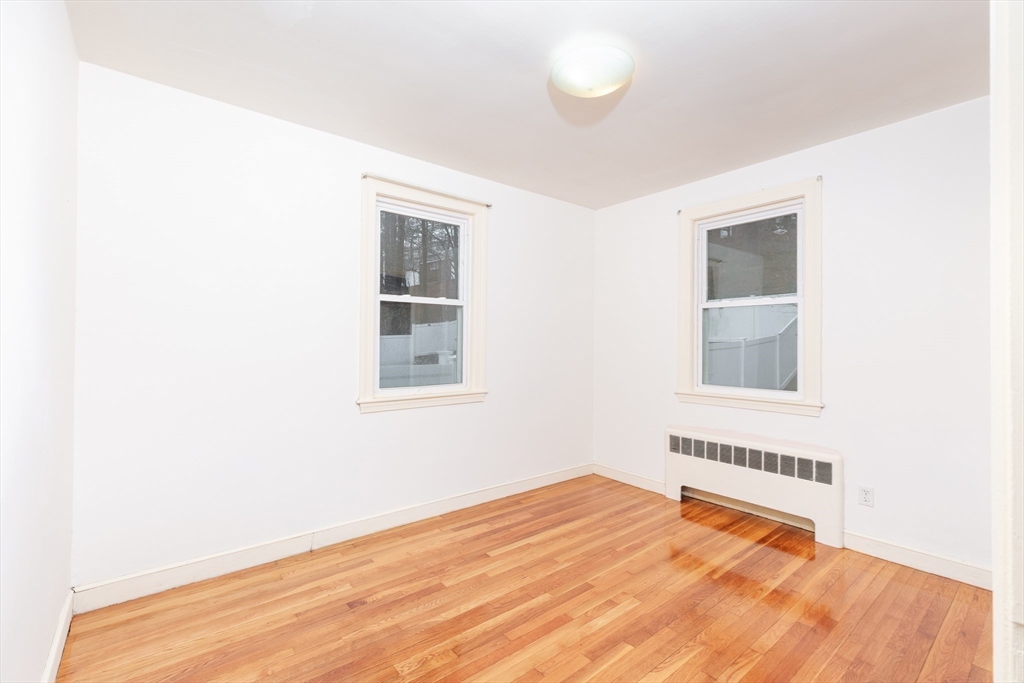 2096 Washington Street Newton, MA 02468 - Photo 8 of 13 a bedroom with a bed and a window