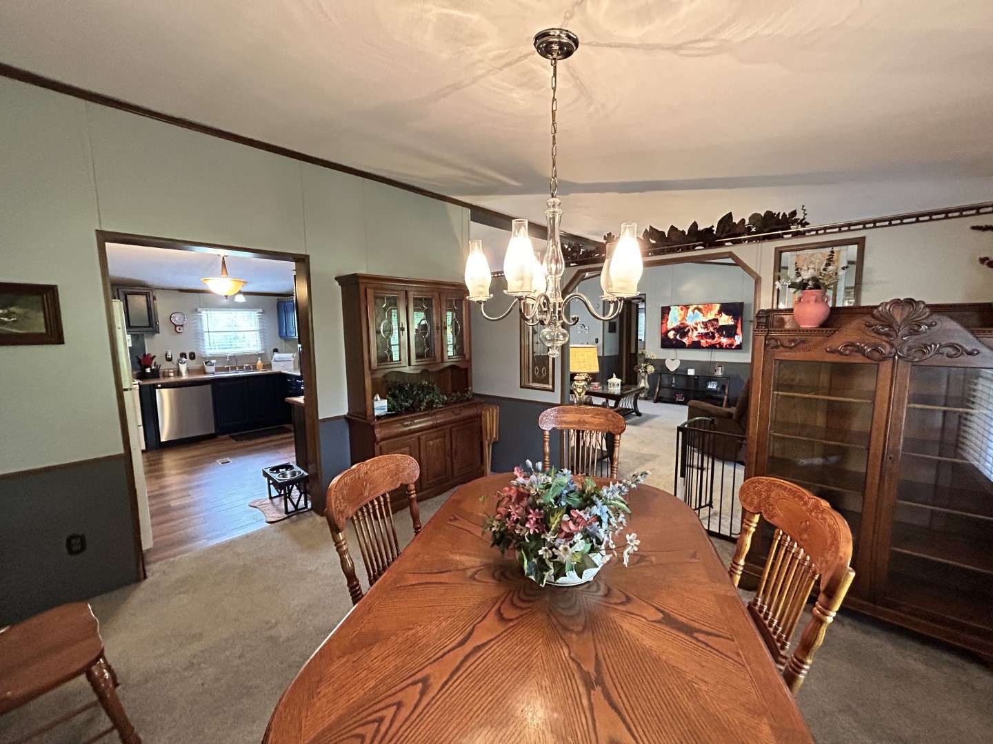 1575 Taylor Road Manchester, TN 37355 - Photo 11 of 28 a living room with furniture kitchen view and a chandelier