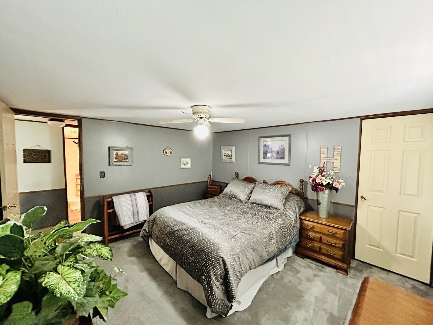 1575 Taylor Road Manchester, TN 37355 - Photo 16 of 28 a bedroom with a bed table and a potted plant