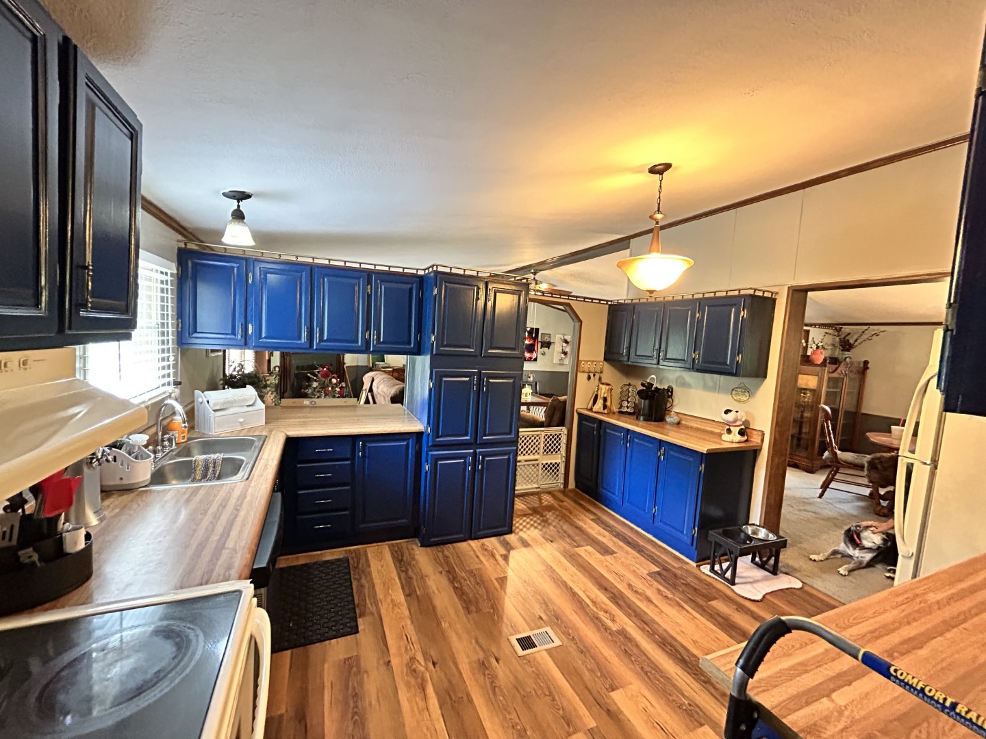 1575 Taylor Road Manchester, TN 37355 - Photo 8 of 28 a kitchen with stainless steel appliances kitchen island granite countertop a stove refrigerator and cabinets