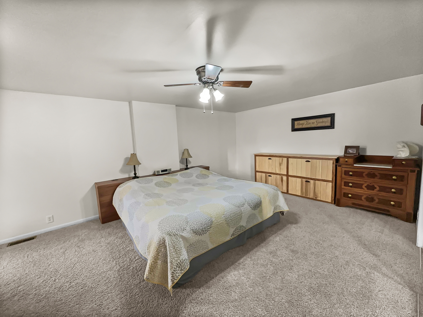 2604 East 1100 North Road Milford, IL 60953 - Photo 17 of 44 a bed room with a bed and a ceiling fan