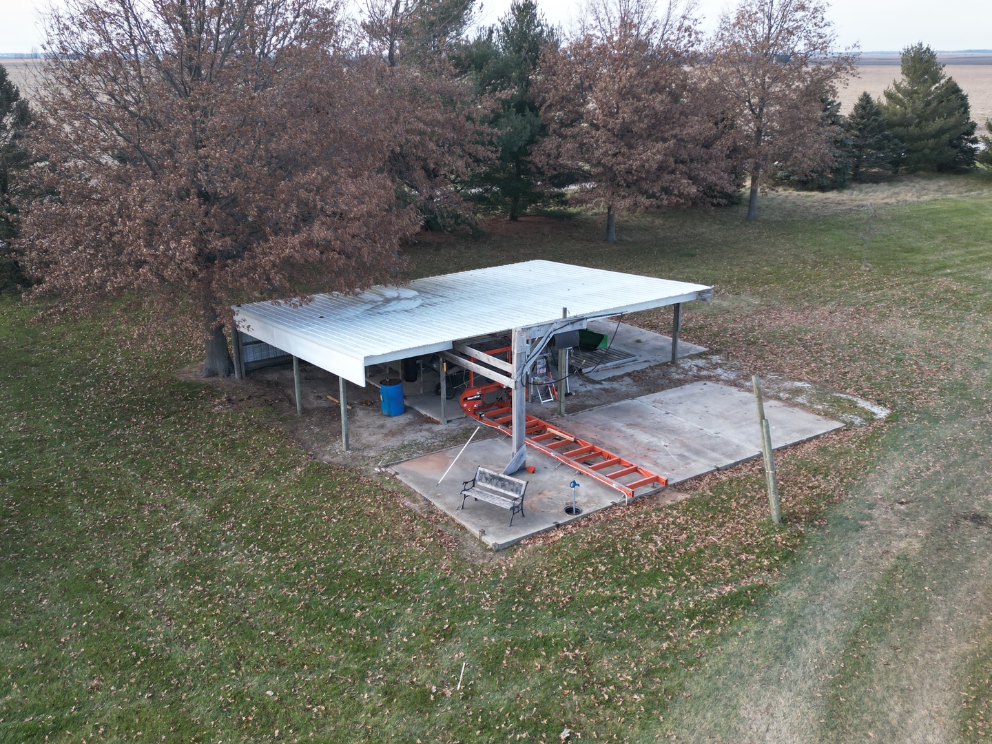 2604 East 1100 North Road Milford, IL 60953 - Photo 8 of 44 an outdoor space with furniture and umbrella