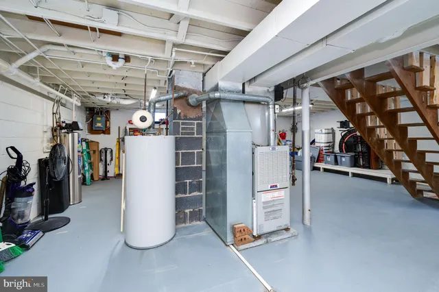 a utility room with sink dryer and washer