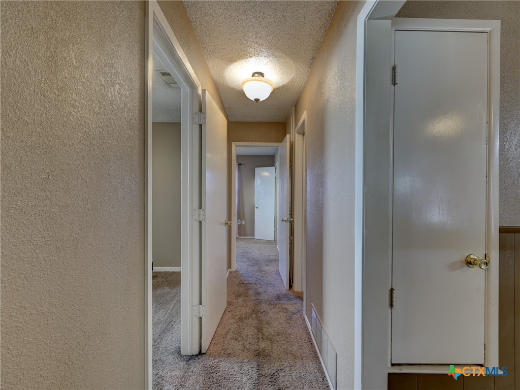 103 Lackey Street Florence, TX 76527 - Photo 18 of 39 a view of a hallway with a elevator