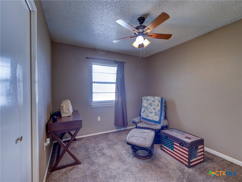 103 Lackey Street Florence, TX 76527 - Photo 19 of 39 a living room with furniture and a window