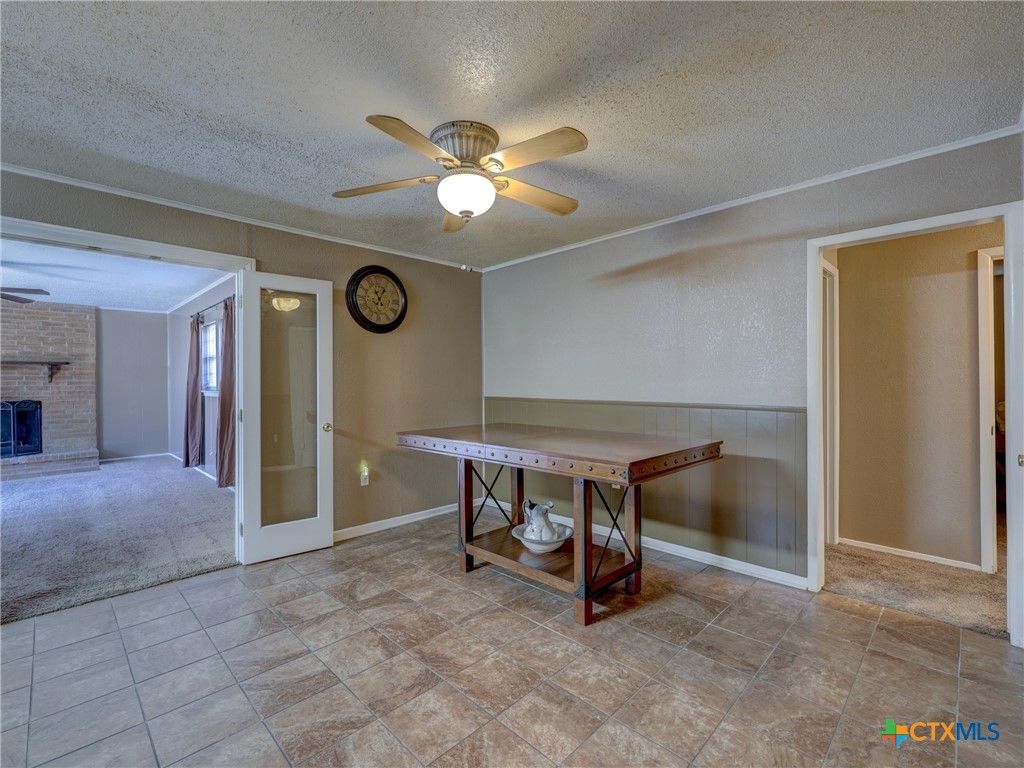103 Lackey Street Florence, TX 76527 - Photo 29 of 39 a view of a livingroom with furniture and a fan