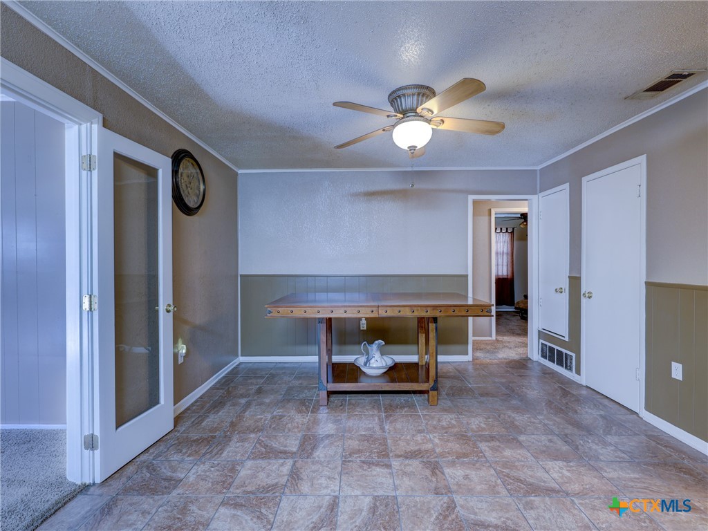 103 Lackey Street Florence, TX 76527 - Photo 30 of 39 a view of a livingroom with furniture and a chandelier fan
