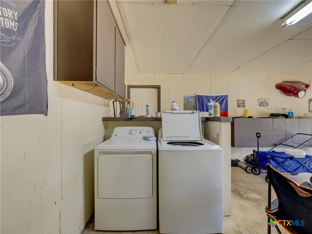 103 Lackey Street Florence, TX 76527 - Photo 38 of 39 a utility room with dryer and washer