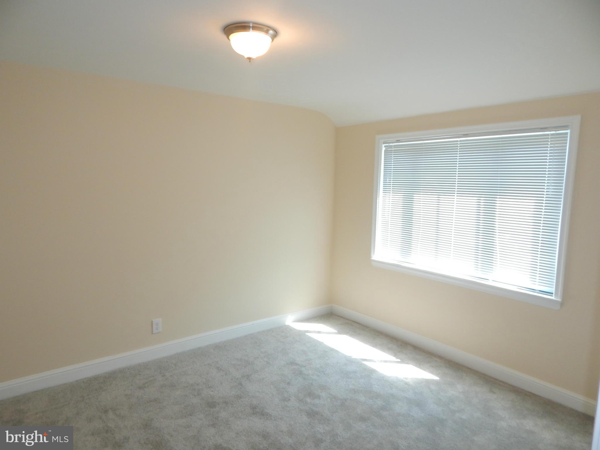 5618 Clearspring Road Baltimore, MD 21212 - Photo 24 of 30 an empty room with a window
