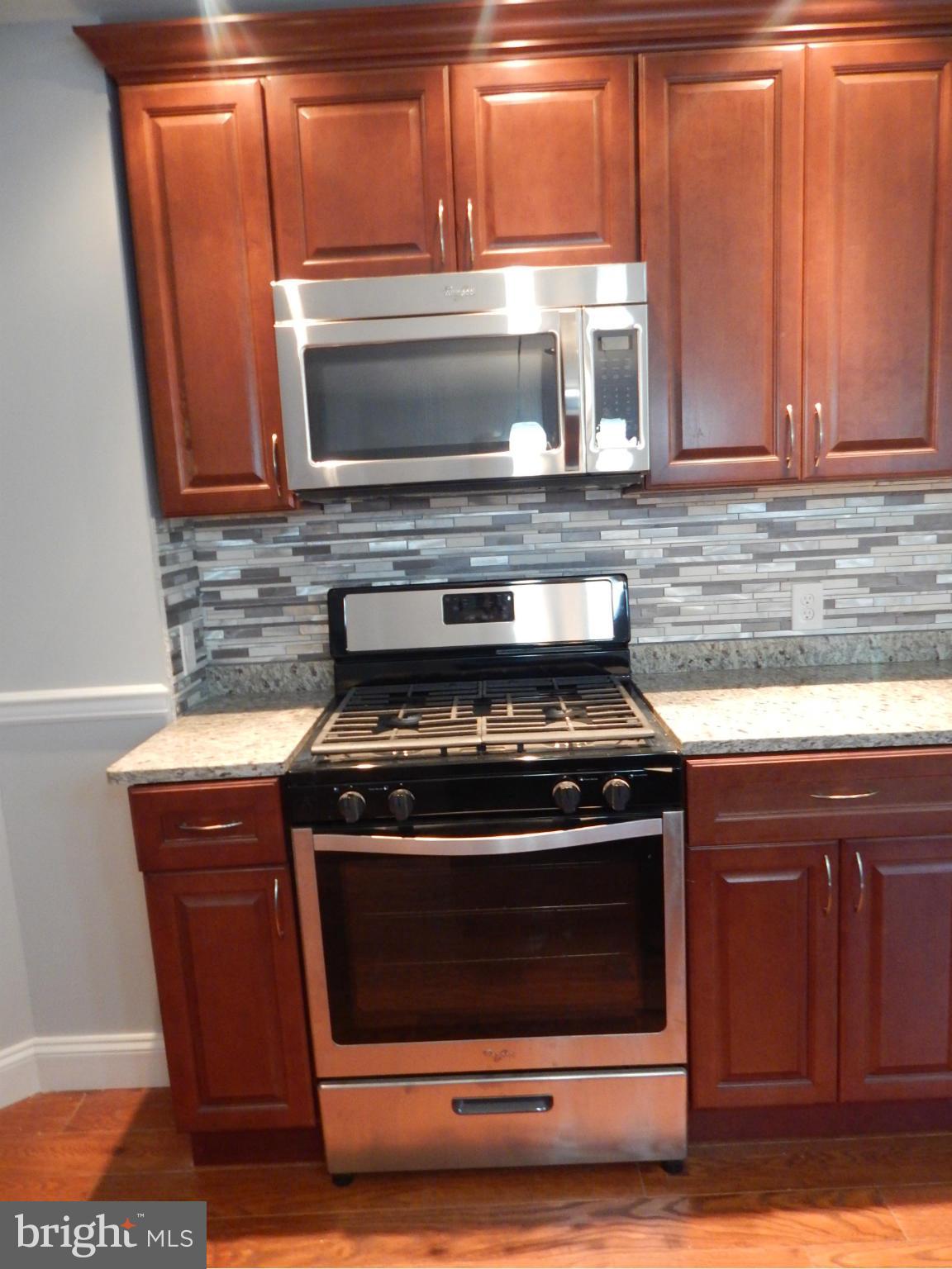 5618 Clearspring Road Baltimore, MD 21212 - Photo 10 of 30 a stove top oven sitting inside of a kitchen