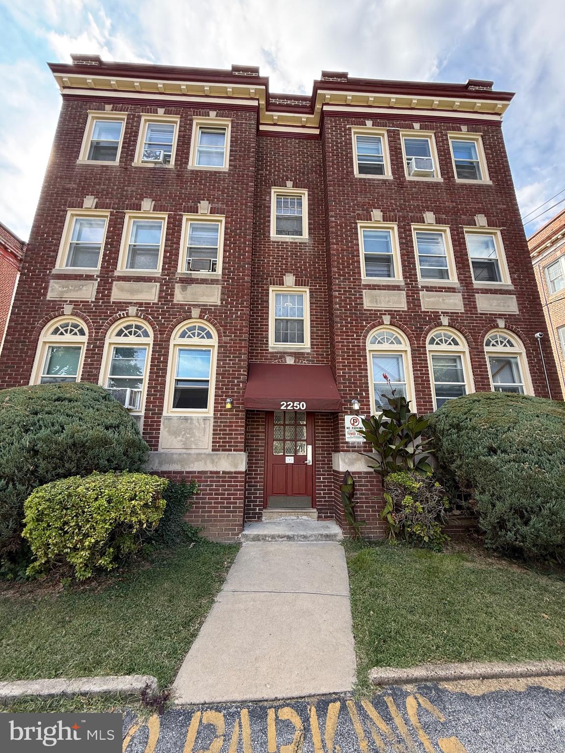 a front view of a building with garden