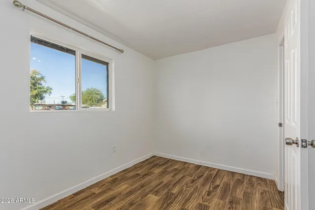 a view of room with window and hallway