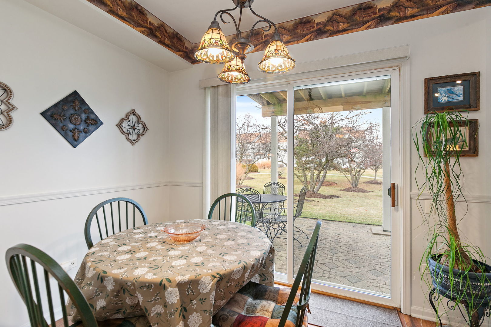 2350 Camden Bay, Unit 2350 Elgin, IL 60123 - Photo 10 of 20 a view of a dining room with furniture window and outside view