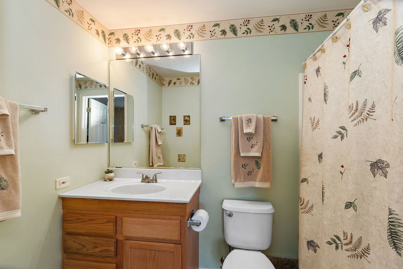 2350 Camden Bay, Unit 2350 Elgin, IL 60123 - Photo 15 of 20 a bathroom with a toilet sink and mirror
