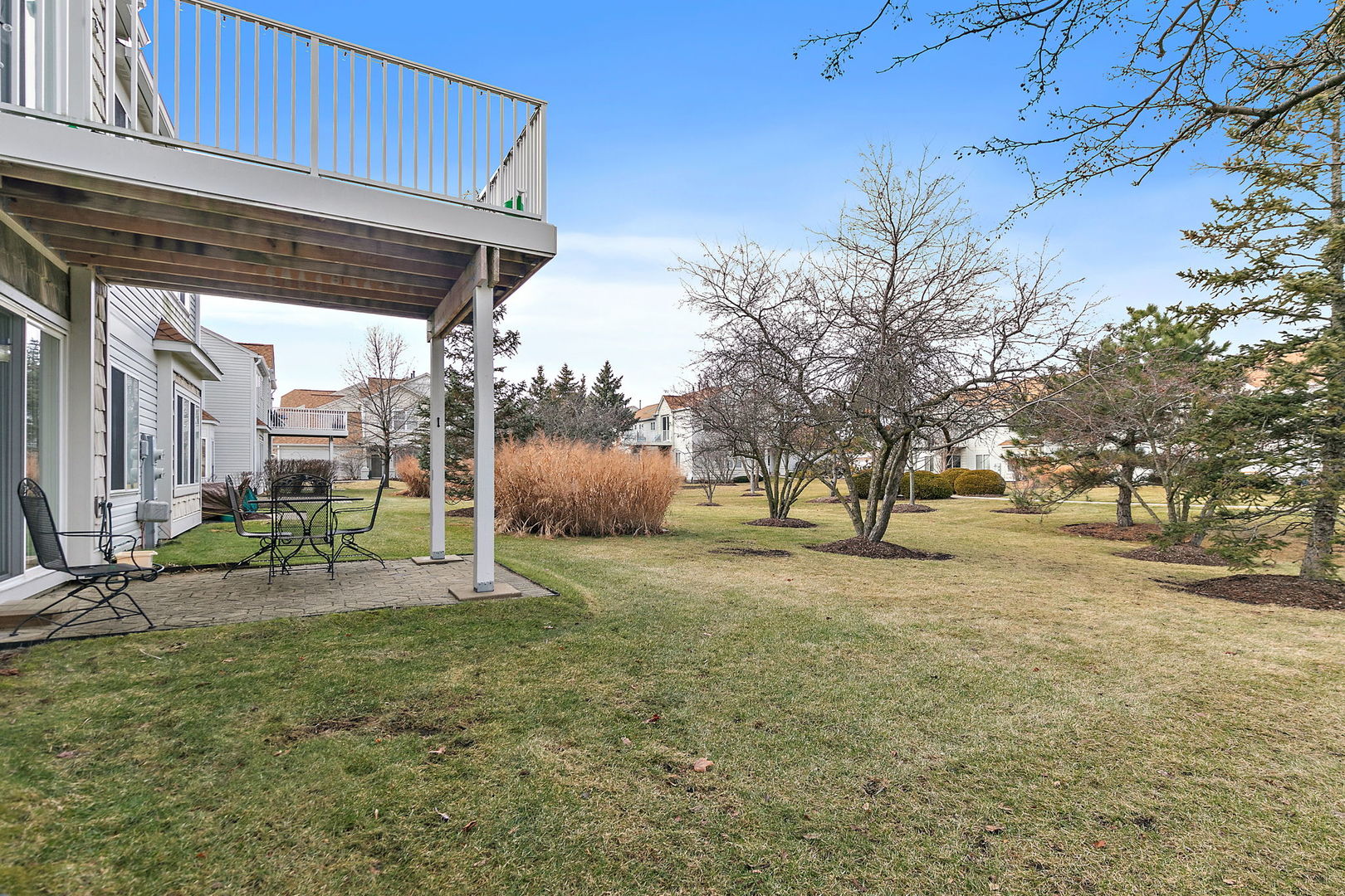2350 Camden Bay, Unit 2350 Elgin, IL 60123 - Photo 18 of 20 a view of a house with backyard and chairs