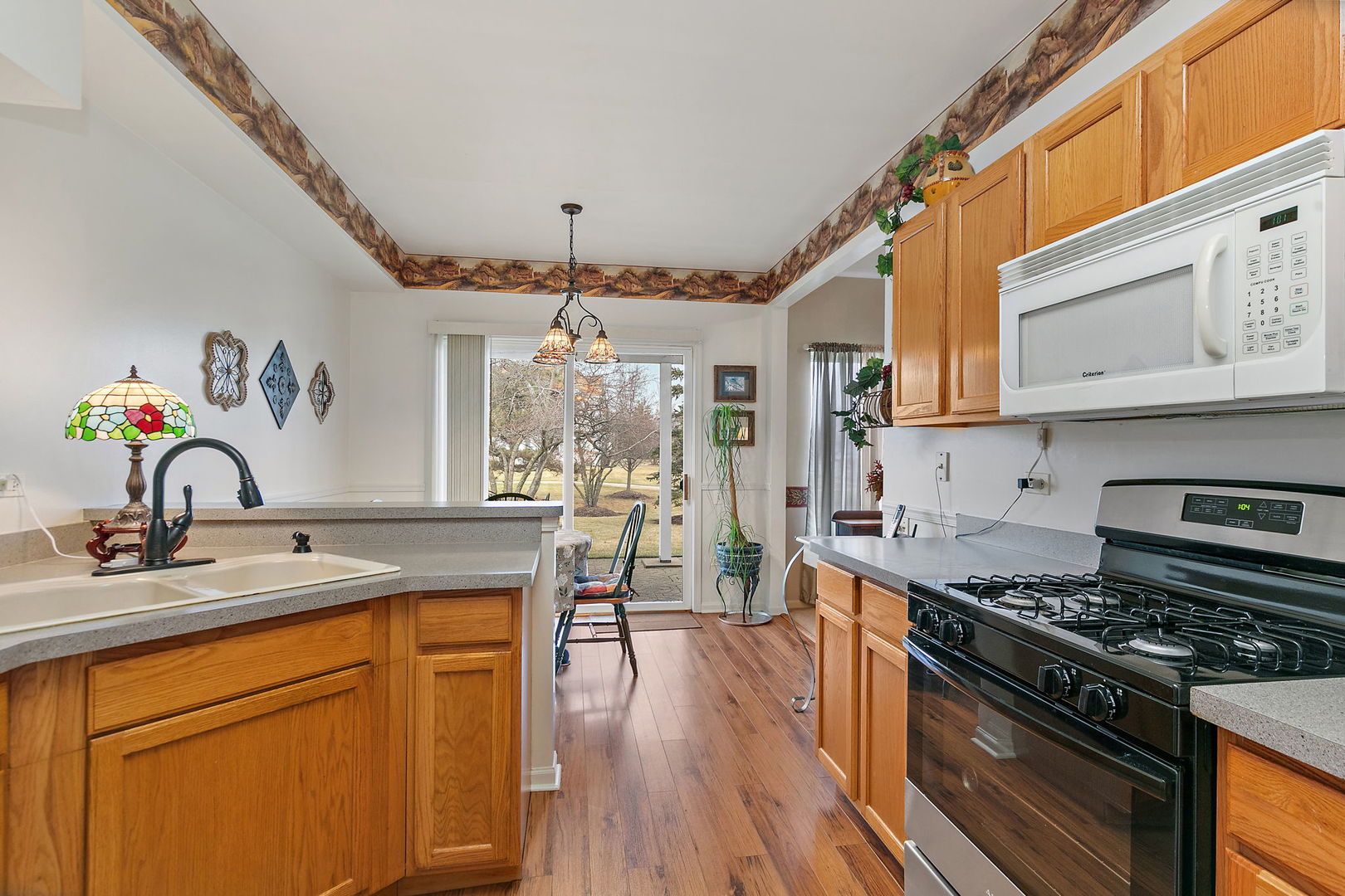 2350 Camden Bay, Unit 2350 Elgin, IL 60123 - Photo 8 of 20 a kitchen with stainless steel appliances granite countertop a stove and a sink