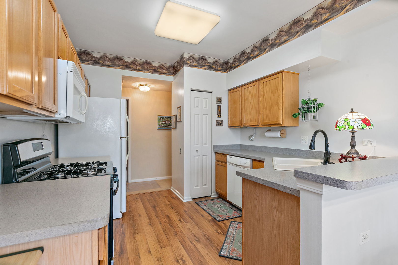 2350 Camden Bay, Unit 2350 Elgin, IL 60123 - Photo 9 of 20 a kitchen with stainless steel appliances a sink stove and refrigerator