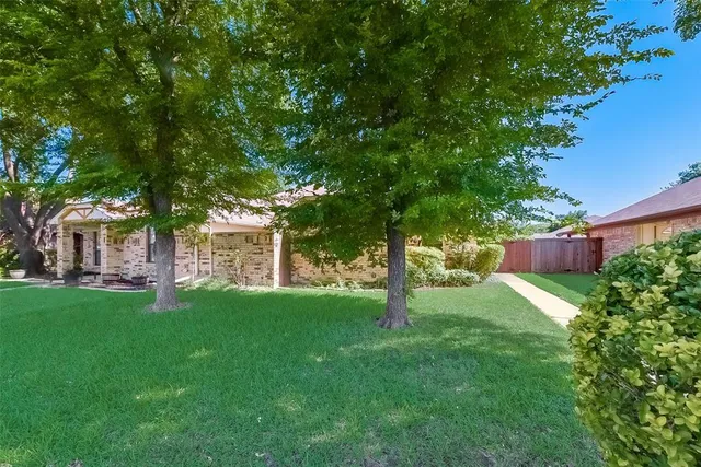 a backyard of a house with lots of green space