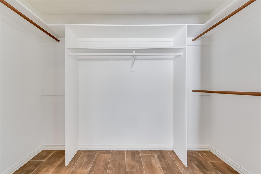 509 Parkway Boulevard Coppell, TX 75019 - Photo 12 of 19 a view of walk in closet with wooden floor