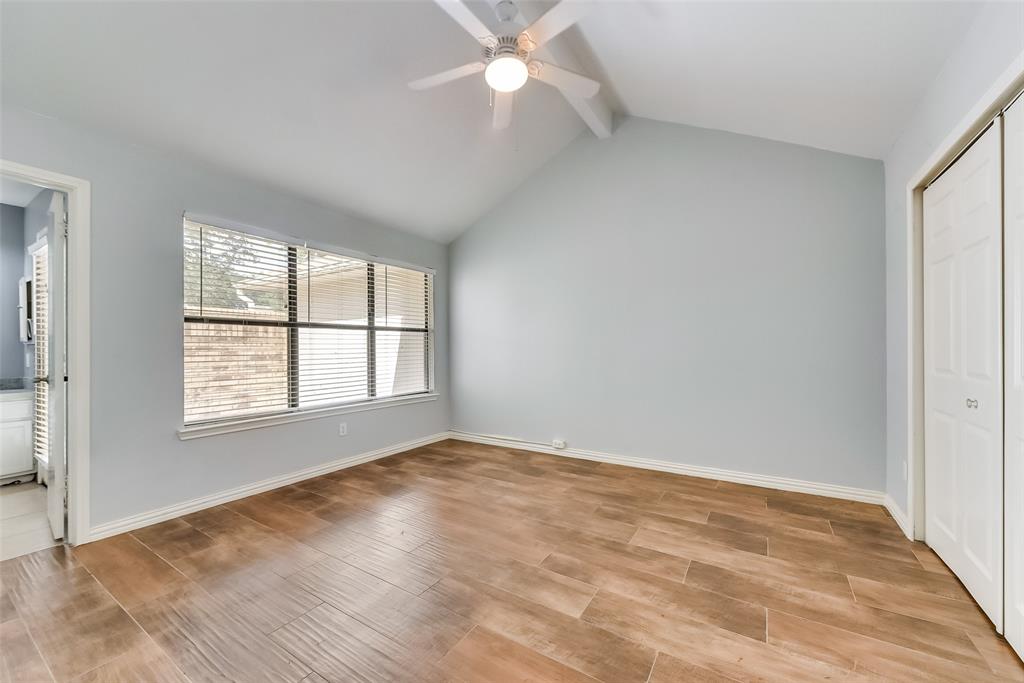 509 Parkway Boulevard Coppell, TX 75019 - Photo 13 of 19 wooden floor in an empty room with a window