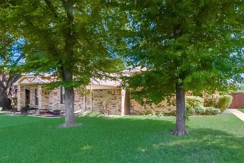 509 Parkway Boulevard Coppell, TX 75019 - Photo 2 of 19 a view of a house with a yard