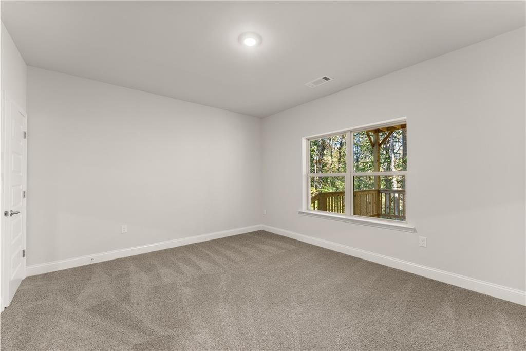 490 Magnolia Grove Place Cornelia, GA 30531 - Photo 17 of 43 an empty room with a window