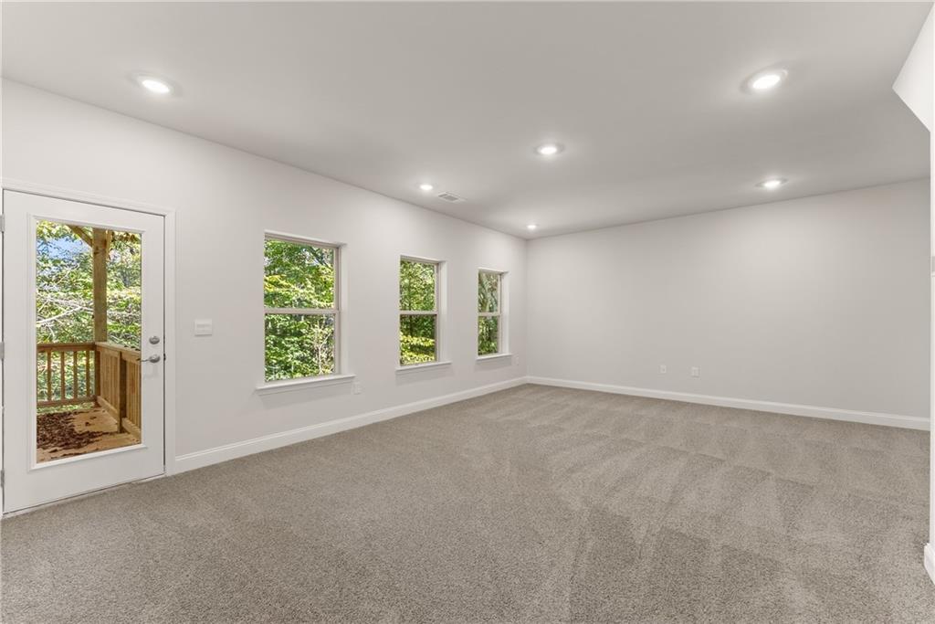 490 Magnolia Grove Place Cornelia, GA 30531 - Photo 19 of 43 an empty room with windows