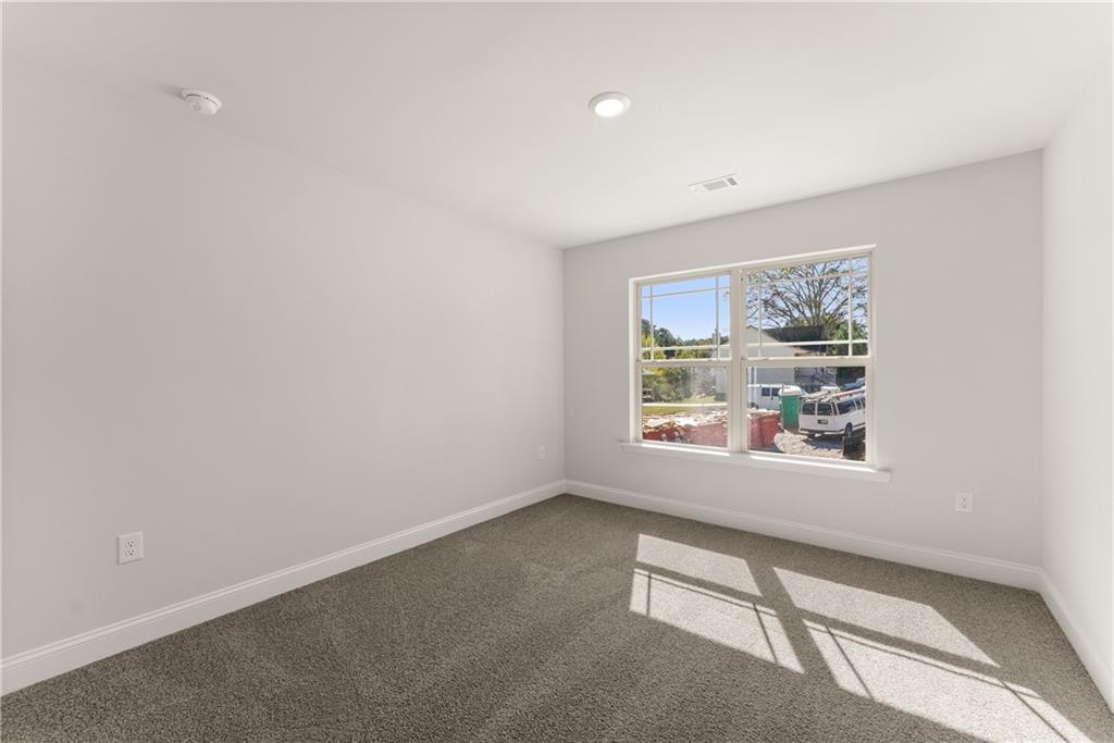 490 Magnolia Grove Place Cornelia, GA 30531 - Photo 26 of 43 an empty room with windows