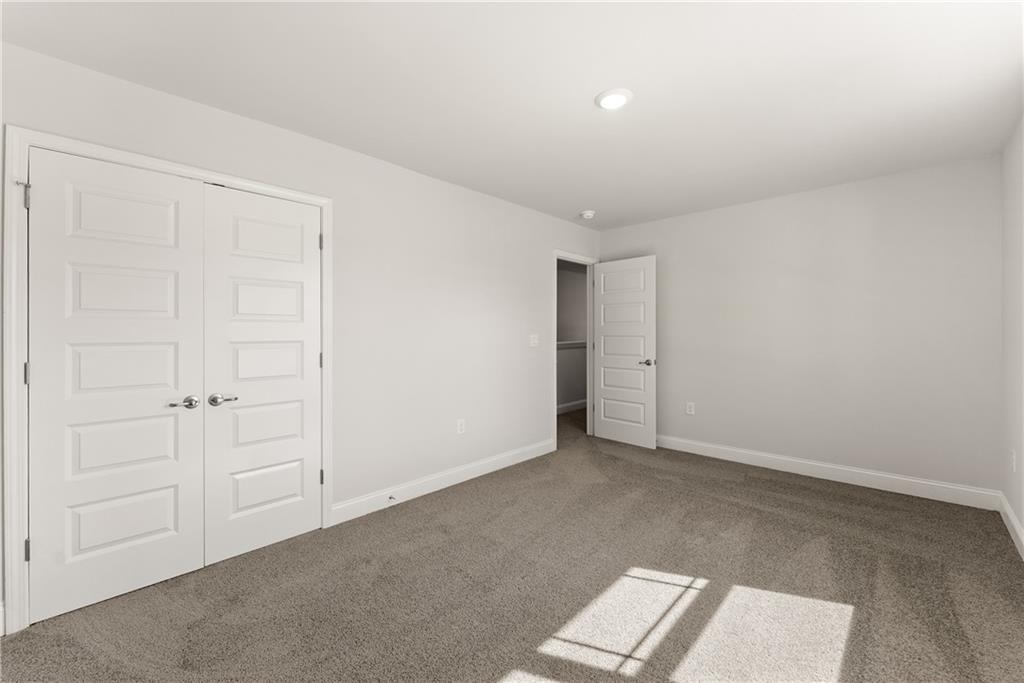 490 Magnolia Grove Place Cornelia, GA 30531 - Photo 31 of 43 an empty room with windows and closet