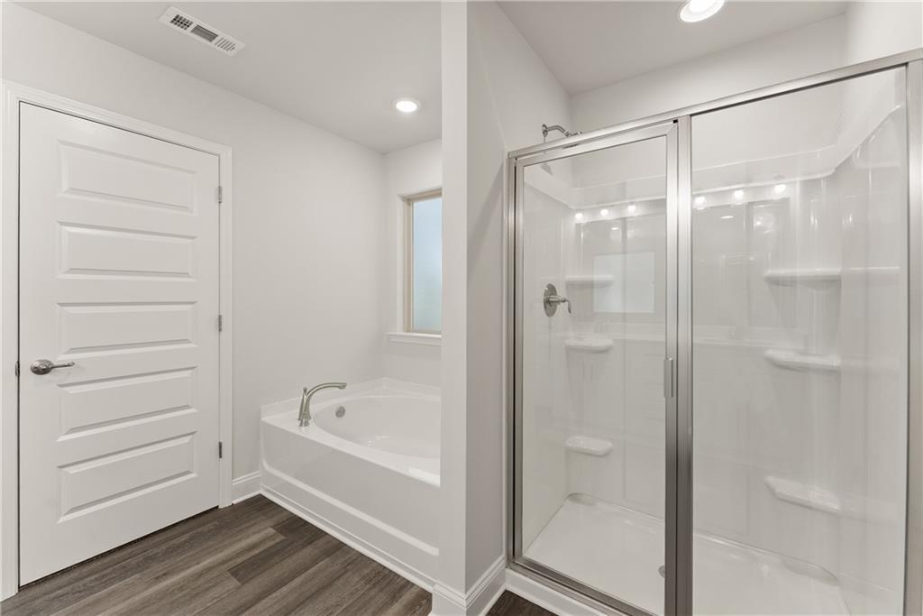 490 Magnolia Grove Place Cornelia, GA 30531 - Photo 37 of 43 a bathroom with a bathtub and a shower