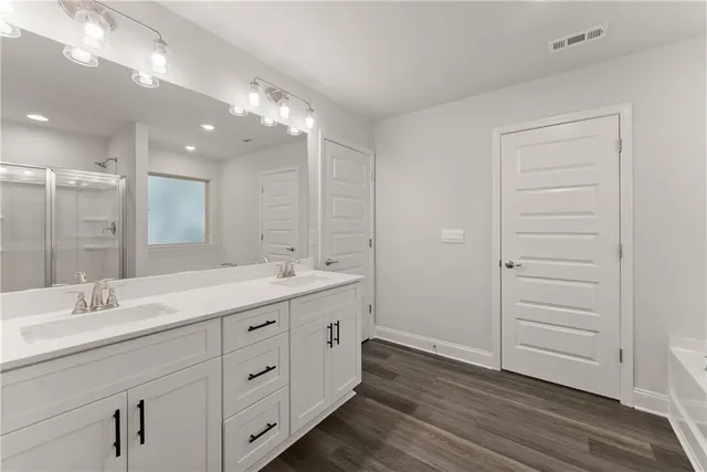 a bathroom with a bathtub and a shower