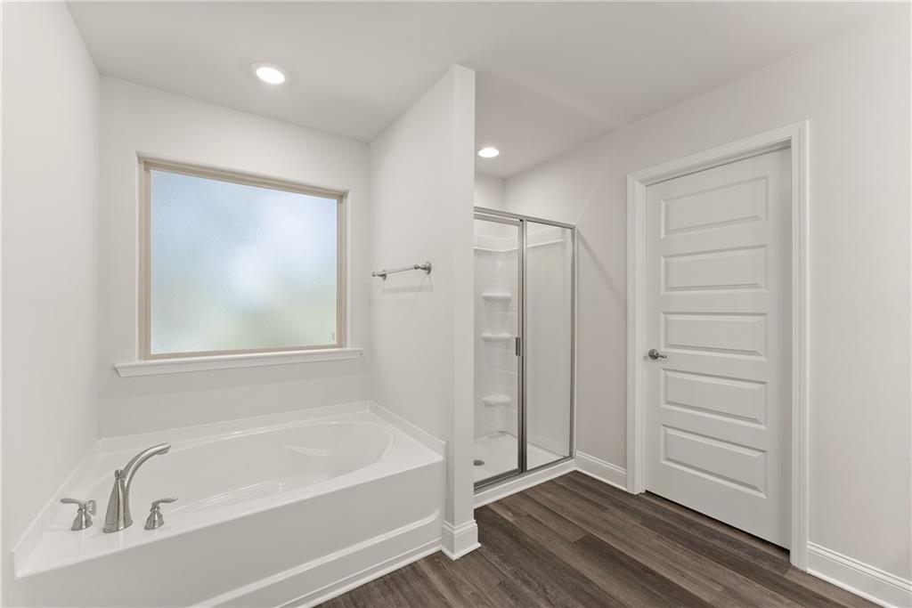 490 Magnolia Grove Place Cornelia, GA 30531 - Photo 39 of 43 a bathroom with a bathtub and a shower