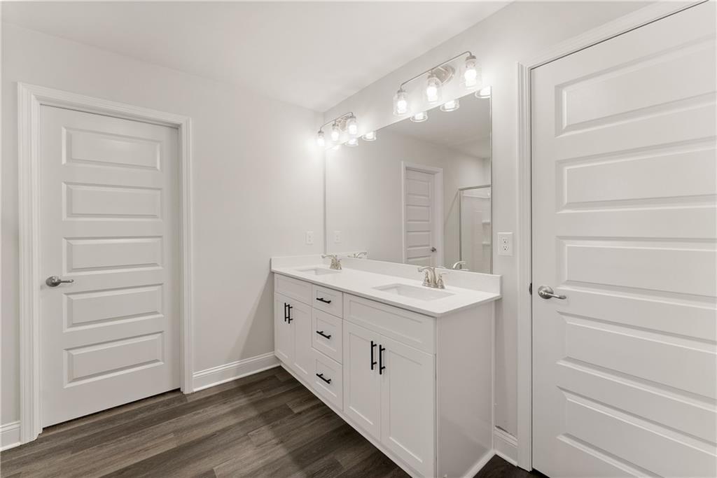 490 Magnolia Grove Place Cornelia, GA 30531 - Photo 40 of 43 a bathroom with a double vanity sink mirror and