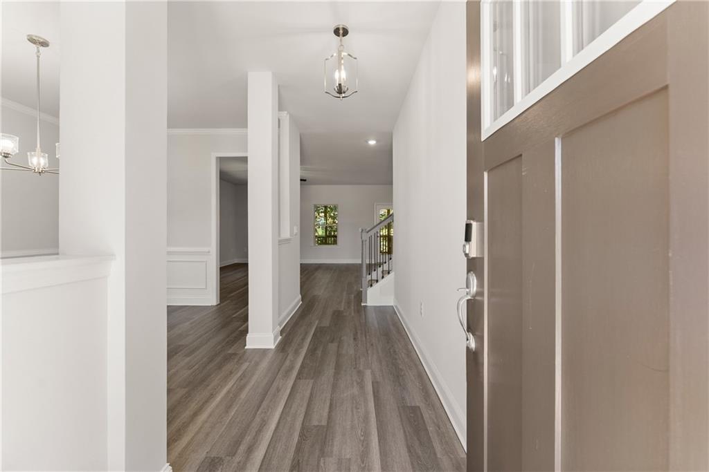 490 Magnolia Grove Place Cornelia, GA 30531 - Photo 6 of 43 a view of a hallway with wooden floor