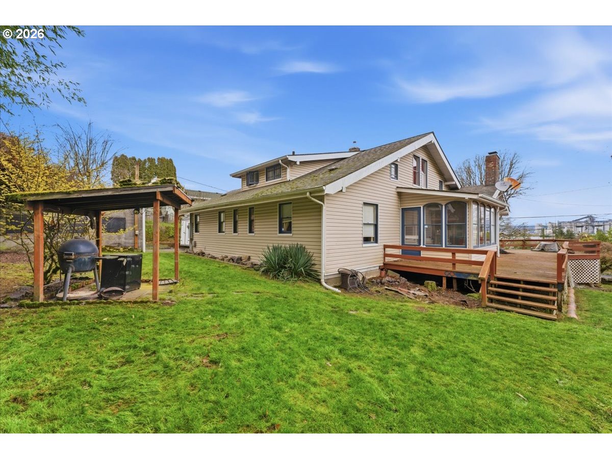 706 West B Street Rainier, OR 97048 - Photo 31 of 47 a view of a house with a yard porch and sitting area