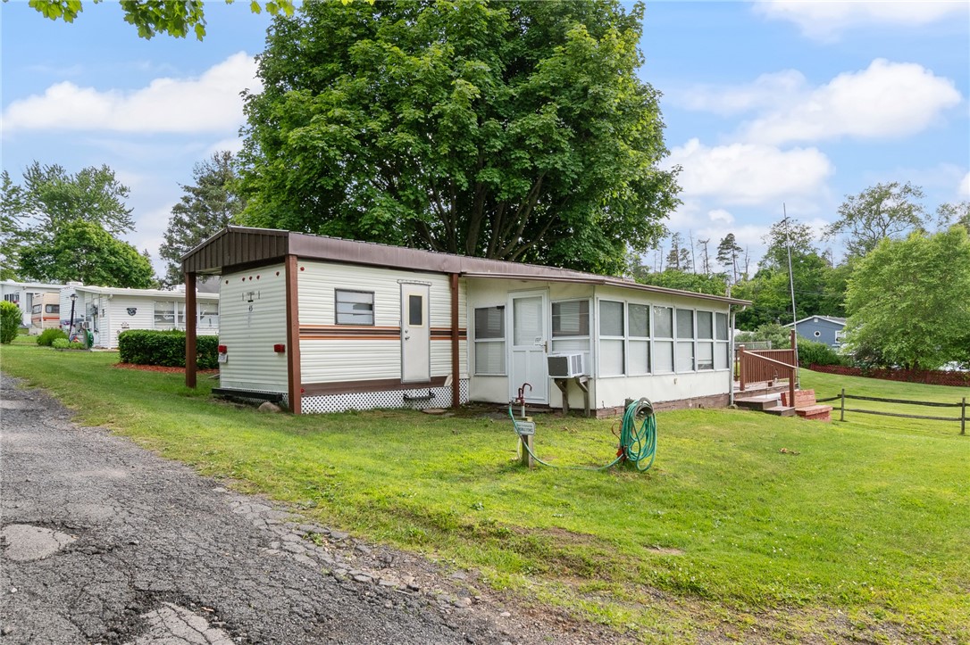 7945 Lake Road, Unit 44 AND 45 Sodus Point, NY 14555 - Photo 16 of 18 THE ROADSIDE VIEW OF THIS UNIT -LOTS #44 AND #45