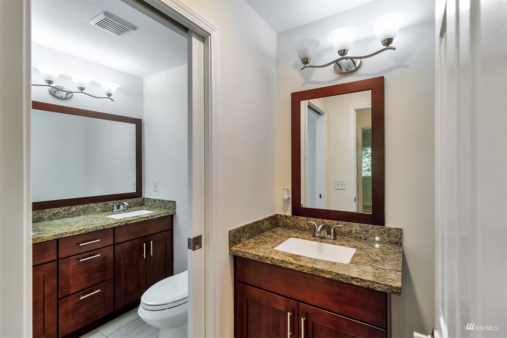 11201 3rd Avenue Southeast, Unit 1B Everett, WA 98208 - Photo 13 of 15 a bathroom with a granite countertop sink and a mirror