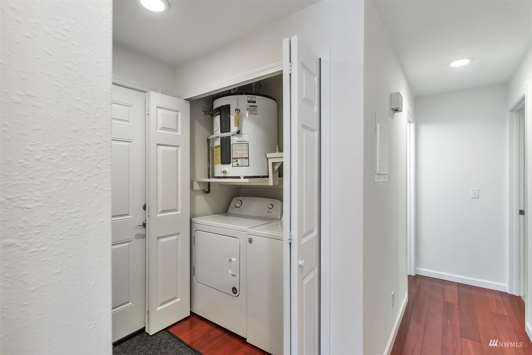 11201 3rd Avenue Southeast, Unit 1B Everett, WA 98208 - Photo 8 of 15 a view of bathroom with a toilet a sink and a mirror