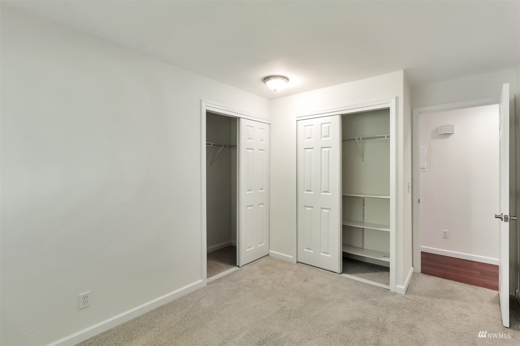11201 3rd Avenue Southeast, Unit 1B Everett, WA 98208 - Photo 10 of 15 an empty room with closet and mirror