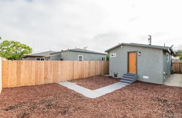 a view of a backyard of a house
