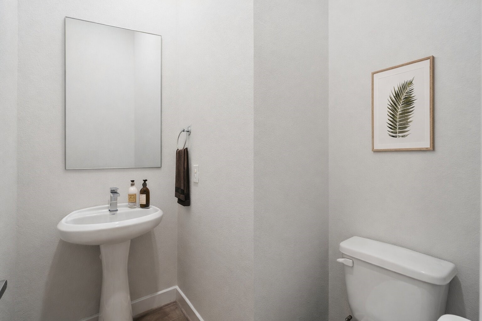 6451 Rena Street Houston, TX 77092 - Photo 18 of 33 Main floor powder bath finished with a pedestal sink and straightforward, low maintenance design.