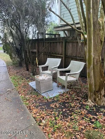 a view of a lounge chair in the backyard