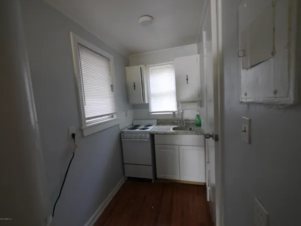 a room with a sink and a mirror