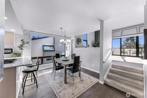 a kitchen with a stove and a white refrigerator